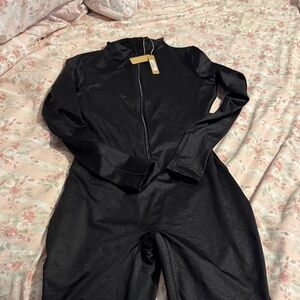Skims , all in one cat suit, front zipper size large, NWT